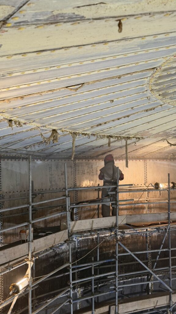 The glass enamel was sweep blasted to expose clean, fresh surfaces, and all exposed steel was prepared to SA2.5 abrasive blasting standards in accordance with ISO 8501-1.